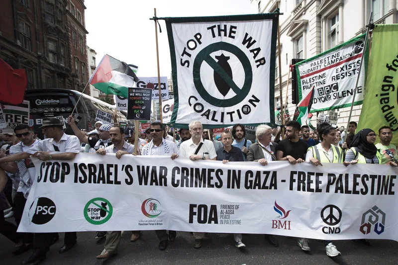  Jeremy Corbyn, center, attends a rally in London against Israel’s bombing of Gaza, 26 July 2014. The left-wing lawmaker has been elected leader of the UK’s main opposition Labour Party. Mark Esper Polaris 