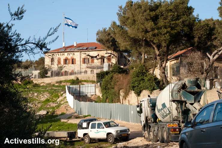 Construction expands the Israeli settlement Beit Orot in the Al Tur neighborhood of East Jerusalem, February 28, 2011. Unilaterally annexed by Israel after the War of 1967, East Jerusalem, including the Old City, are still considered occupied Palestinian territory under international law. (photo: Ryan Rodrick Beiler/Activestills.org)