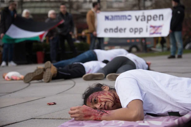  Palestine solidarity activists&nbsp;stage a die-in&nbsp;outside&nbsp;the Norwegian parliament in Oslo on 30&nbsp;March. 